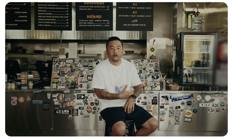 Roy Choi is sitting in a restaurant